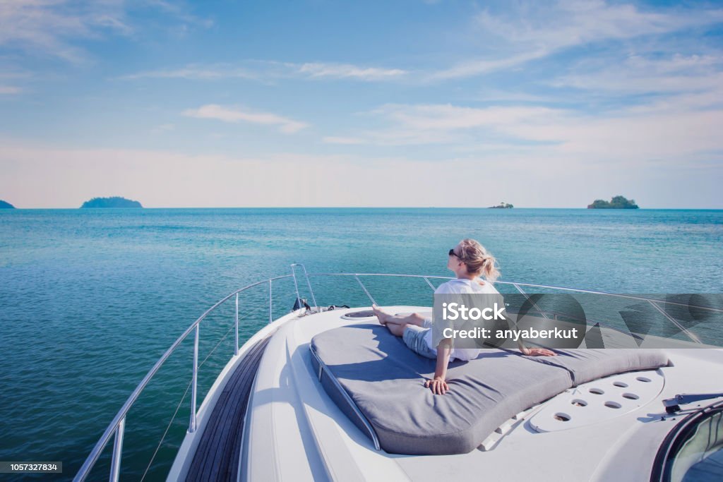 beautiful woman enjoying luxurious yacht cruise, sea travel by luxury boat